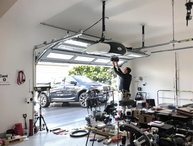 Naugatuck Garage Door Repair specialist installing smart garage door opener system in Naugatuck home