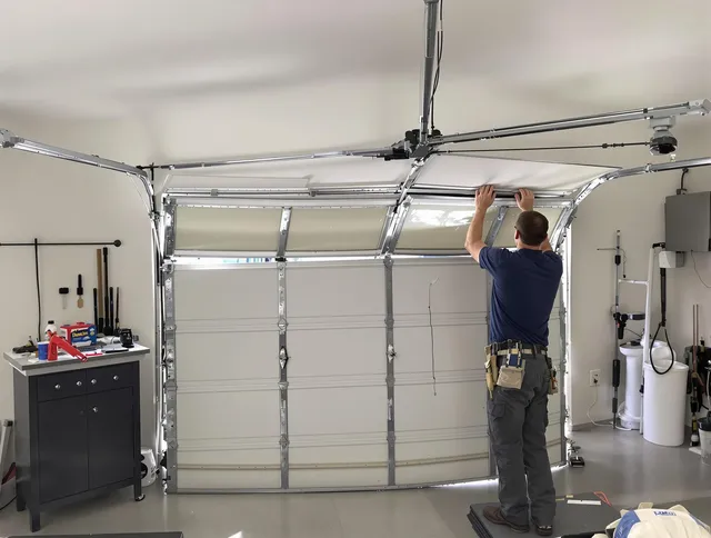 Naugatuck Garage Door Repair specialist performing precise section replacement on Naugatuck garage door