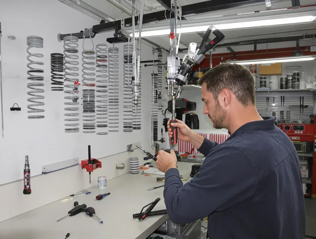 Naugatuck Garage Door Repair safety certified technician performing precision spring replacement in Naugatuck